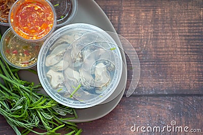 Yummy food is Oysters with herbs, Kathina leaves and chili source Stock Photo