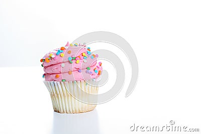 Yummy pink sprinkle cupcake Stock Photo