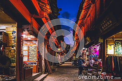 YUNNAN,CHINA 14 february 2022 - night scenic view of narrow street with souvenir shops in the Old Town of Lijiang Editorial Stock Photo