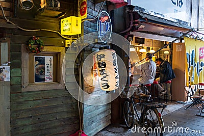 Yuraku Concourse restaurants under the train tracks are specialized in yakitori. Editorial Stock Photo