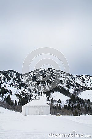 Yurt in trees in the northern utah mountains in the winter Stock Photo