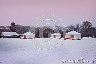 Yurts in the archaeological park `Argamach` in the winter early in the morning, Russia Stock Photo