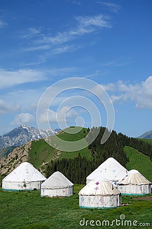 Yurts under blue sky Stock Photo