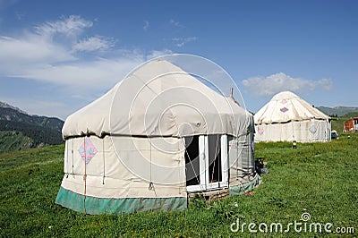 Yurts under blue sky Stock Photo