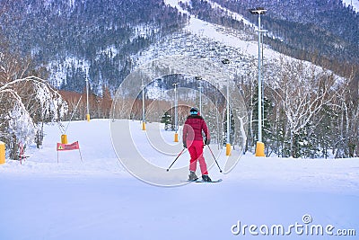 Yuzhno-Sakhalinsk, Russia - Jan 01, 2022: skiers in the slopes of the skiing resort Mountain Air. Editorial Stock Photo