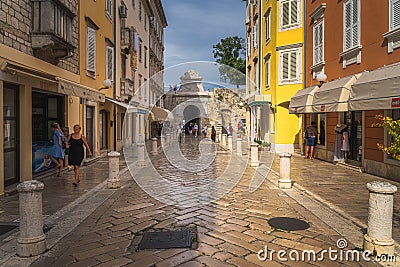 Tourists visiting beautiful narrow streets of the old town district of Zadar Editorial Stock Photo