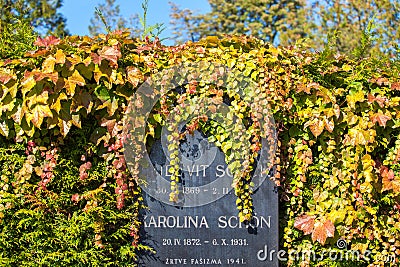 Zagreb, Croatia - October 2018. Autumn leaves as decoration on chapels and tombstones in the cemetery in the fall Editorial Stock Photo