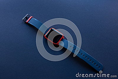 Smartwatch fitness tracker, black and orange Editorial Stock Photo