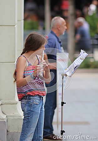 Zagreb Street Musician / Girl Playing Flute Editorial Stock Photo