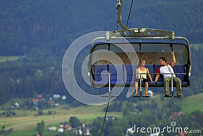 Zakopane, Poland - Tourists enjoying panoramic view from cable lift to the Butorowy Wierch peak and Gubalowka Mountain near Editorial Stock Photo
