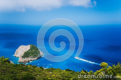 Zakynthos fantastic west coastal view with white cliff. White tourist ship sailing full speed on open azure sea water Stock Photo