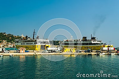 Zakynthos, Greece Andreas Kalvos and Mare di Levante Ferries car passenger boats with distinctive colors and logo moored on a calm Editorial Stock Photo