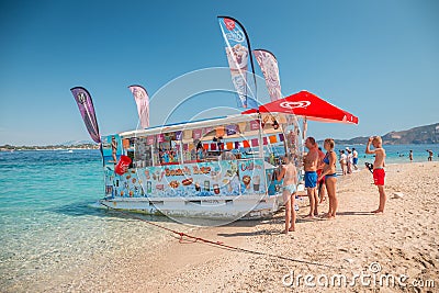 Zakynthos, Greece, Turtle island - August 2019: Floating boat shop with fruits, ice cream, various drinkg and snacks Editorial Stock Photo