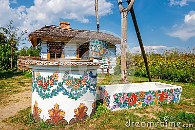 Zalipie, Poland, August 19, 2018: A bucket over a well in the colorful village - Zalipie, Poland. It is known for a local custom Editorial Stock Photo