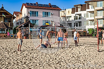 A team of young people playing volleyball on the beach in Zalizny Port Kherson region. Editorial Stock Photo