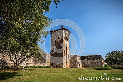 Zanana Enclosure with watch tower in back under blue cloudscape. Hampi, Karnataka, India Editorial Stock Photo