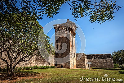 Zanana Enclosure with watch tower in back under blue cloudscape. Hampi, Karnataka, India Editorial Stock Photo