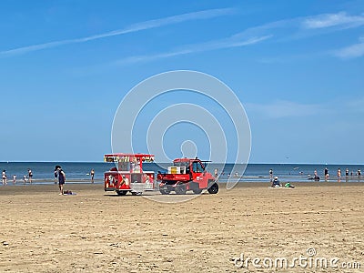 View on red vehicle with trailer selling ice cream on beach of dutch north sea in summer Editorial Stock Photo
