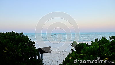 Zanzibar Sunset with Fisherman Boats in the Distance. Stock Photo