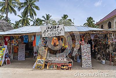 Front view of African shop clothes and souvenirs for tourists on the beach in Zanzibar island, Tanzania, east Africa Editorial Stock Photo