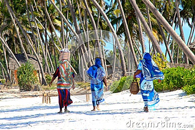 Zanzibar women on sandy beach Stock Photo