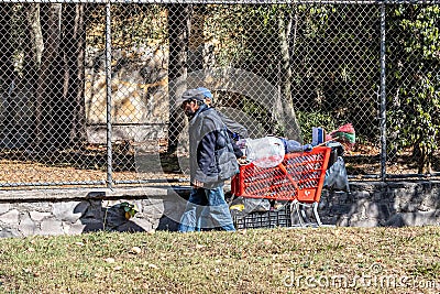 Zapopan, Jalisco Mexico. January 1, 2023. Two homeless Latin American men walking on the sidewalk Editorial Stock Photo