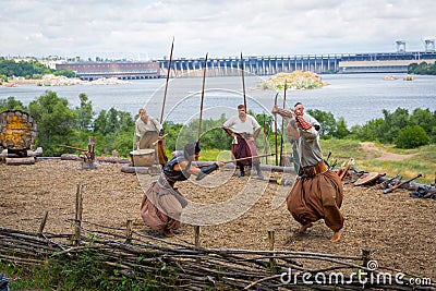 ZAPORIZHIA, UKRAINE-JUNE 21: Ukrainian Cossacks 21, 2014 in Zaporizhia, Ukraine. Show of Ukrainian Cossacks in Cossacks Museum on Editorial Stock Photo