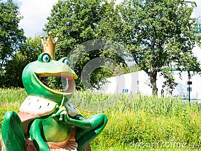 Sculpture of frog princess on green shore of lake Editorial Stock Photo