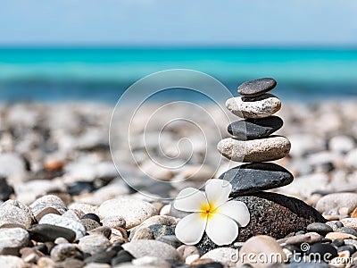 Zen balanced stones stack with plumeria flower Stock Photo