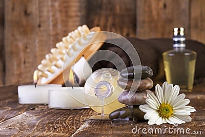 Zen basalt stones and spa oil with candles on the wood Stock Photo