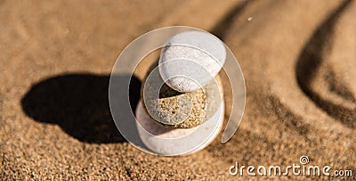 zen meditation stone in sand, concept for purity harmony and spirituality, spa wellness and yoga background Stock Photo