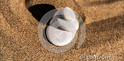 zen meditation stone in sand, concept for purity harmony and spirituality, spa wellness and yoga background Stock Photo