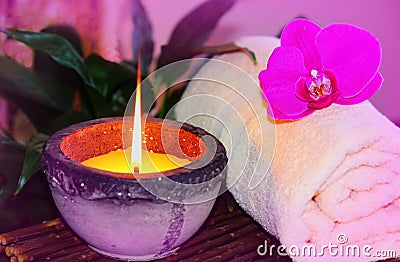 Zen orchid aromatic candle and towel spa concept Stock Photo