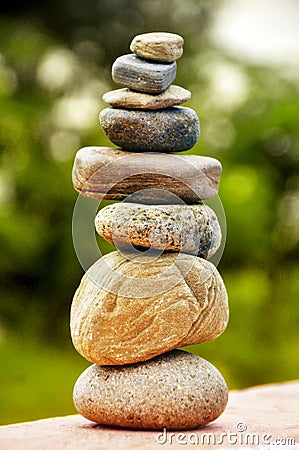 Zen spa stones stack, balance zen spa stones stacked to pyramid in the soft green background Stock Photo