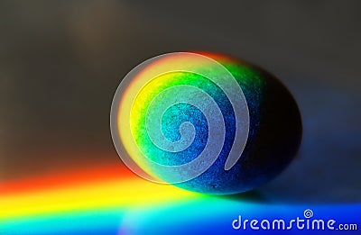 Zen stone in touch of rays of color Stock Photo