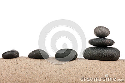 Zen stones pyramid on sand beach, meditation, concentration, relaxation, harmony, balance Stock Photo