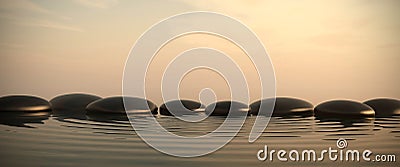 Zen stones in water on sunrise Stock Photo