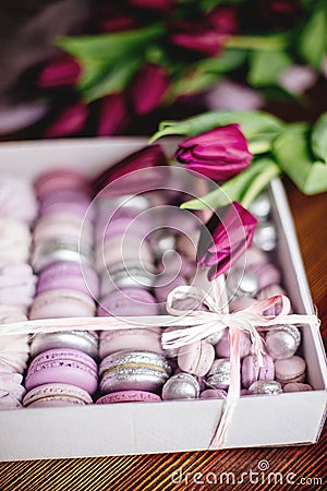 Zephyr, macaroons and tulips. Stock Photo