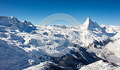 Zermatt Matterhorn and glacier monte rosa sunset view mountain winter snow landscape Swiss Alps clouds panorama Stock Photo