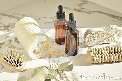 Zero waste. Bathroom accessories, natural brush, wooden comb, oil, makeup remover in a glass container, bamboo toothbrushes. Eco Stock Photo