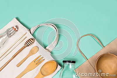 Zero waste concept. Set of environmentally friendly wooden kitchen appliances. Textile eco bags, glass jars and bamboo. Stock Photo