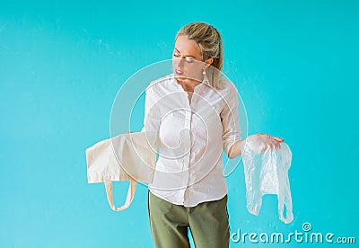 Zero waste concept. Woman choosing to use multi-use bag instead of plastic one Stock Photo