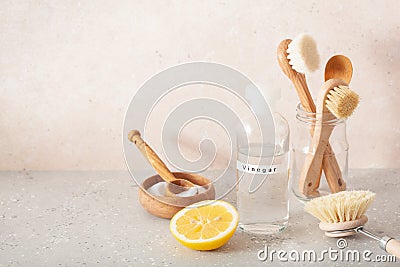 Zero waste eco friendly cleaning concept. wooden brushes, lemon, baking soda, vinegar Stock Photo