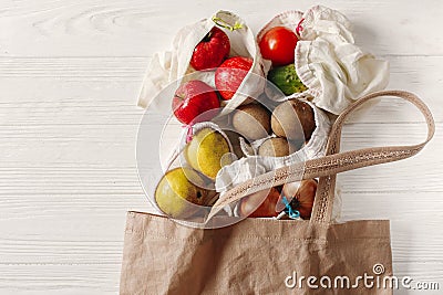 zero waste food shopping. eco natural bags with fruits and vegetables in tote, eco friendly, flat lay. sustainable lifestyle Stock Photo