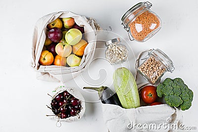 Zero Waste Food Storage Eco Bag Top View. Reusable cotton bag with vegerables, fruits, glass jar Stock Photo