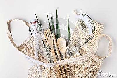 Zero waste, plastic-free and eco-friendly lifestyle. Cotton mesh bag, glass bottle, jar and bamboo cutlery for package free Stock Photo