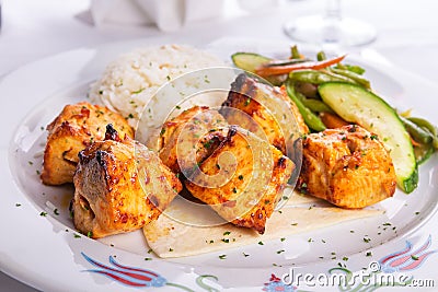 Zesty Chicken Shish Kebabs served on a Lavash Bread with rice Pi Stock Photo