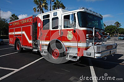 Firetruck idling and ready. Parked on fresh blacktop Editorial Stock Photo