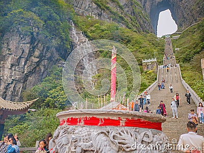 Crowd of tourist Climbing Heaven gate cave stairs on tianmen mountain national park at Zhangjiajie city china. Editorial Stock Photo