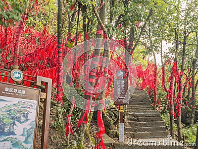 Red ribbon with writing Wish hang the Tree in Red ribbon Forest on tianmen mountain at zhangjiajie city china. Editorial Stock Photo